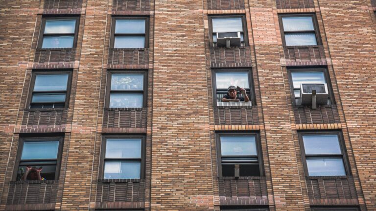 brown brick building with glass windows
