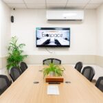 A modern conference room with a tv.