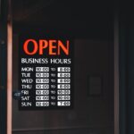 a sign on a door that says open business hours