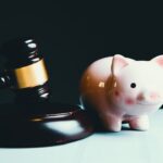 pink pig ceramic figurine on black and white round plate